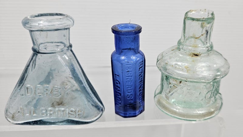 Collection of old Victorian embossed glass ink bottles Carousel 3