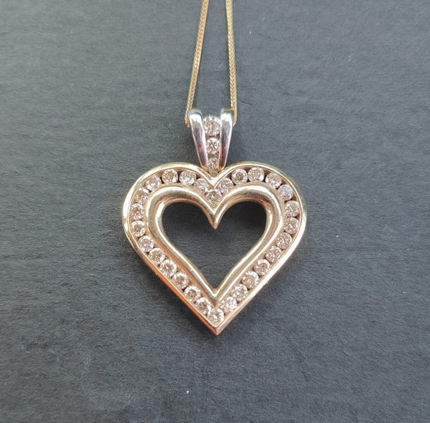 Gorgeous 10ct gold and diamond heart pendant Carousel 1