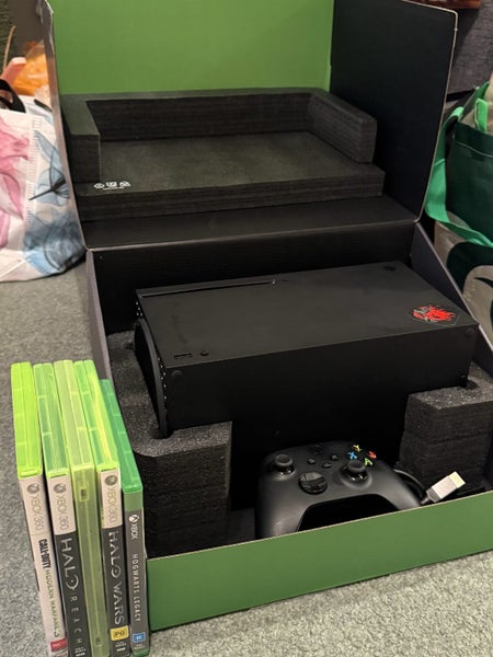 xbox series X and controller with some games Carousel 2