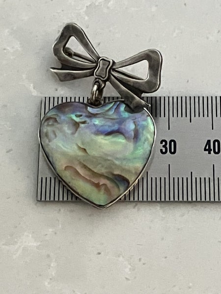 Fabulous vintage sterling silver brooch - paua heart suspended from a silver bow Carousel 2