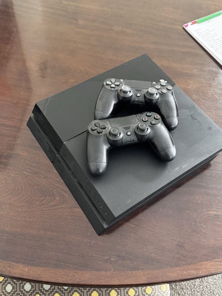 PS4 with 2 Sony offical controllers 2 games Carousel 1