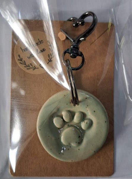 Handmade ceramic paw print keyring Carousel 1