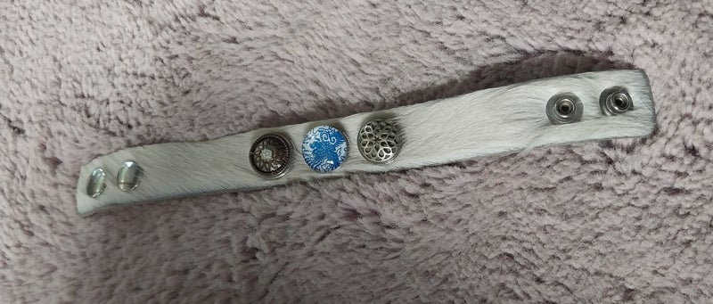 Noosa Amsterdam cowhide fur bracelet with dome charms. Carousel 2