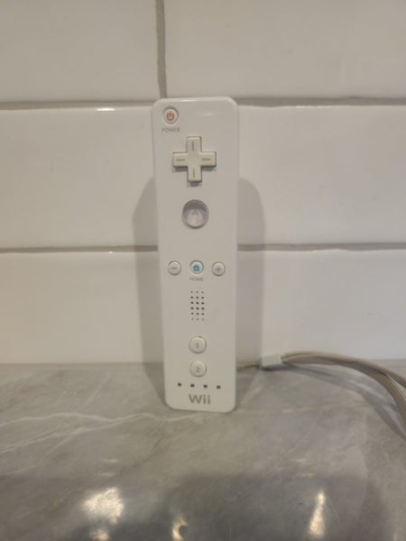 White Wii Plus one games and Offical Controller Carousel 7