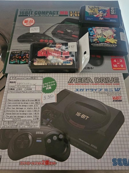 2 consoles. 2 carliges.Sega mega drive mini and 16 bit compactor Carousel 1