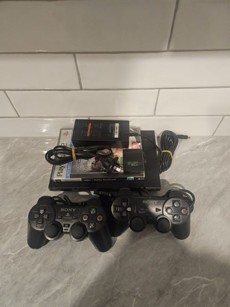 Ps2 77002 Slim Plus Two Controllers And One Game Carousel 1