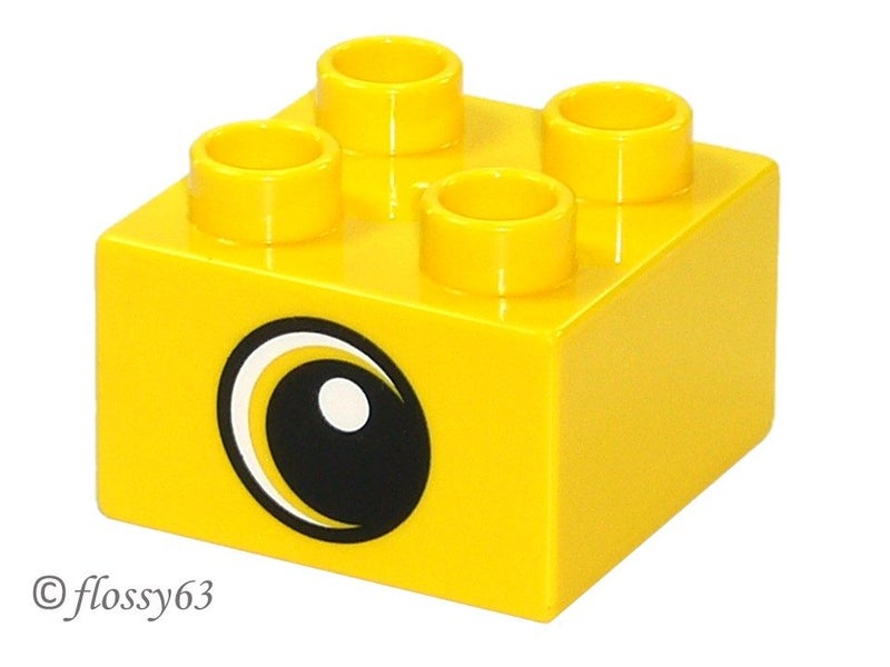 ®™DUPLO - Yellow Brick 2 x 2 Black Pupil & White Dot & Large Crescent Eye Patt Carousel 1