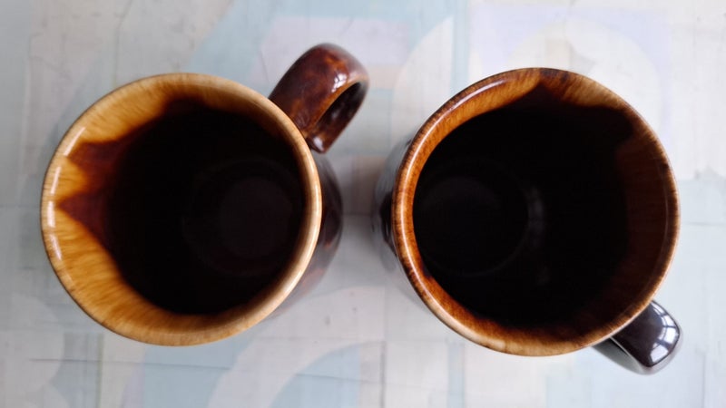 Two Crown Lynn 1160 coffee mugs - one marked 'A' on bottom Carousel 2