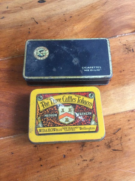 A GROUP OF FOUR EARLY TOBACCO TINS ONE MILITARY Carousel 1