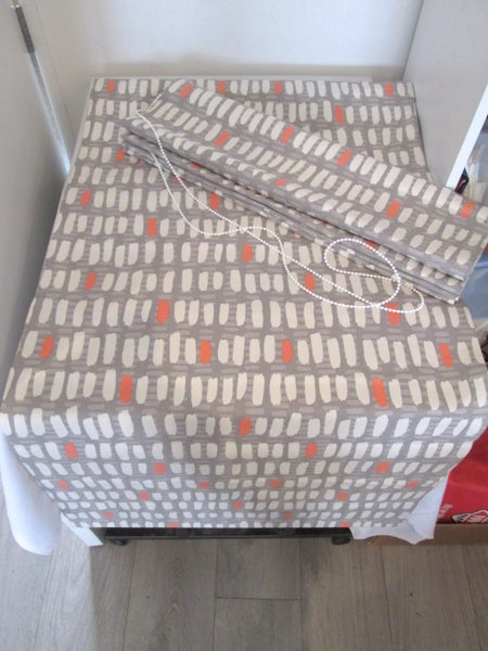 Two Patterned Roman Blinds Carousel 1