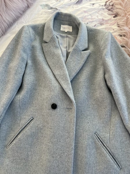 Light blue coat Carousel 1