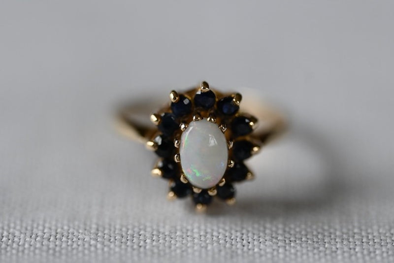 A Vintage 9 Carat Gold Opal & Sapphire Oval Cluster Ring (1973) Carousel 1