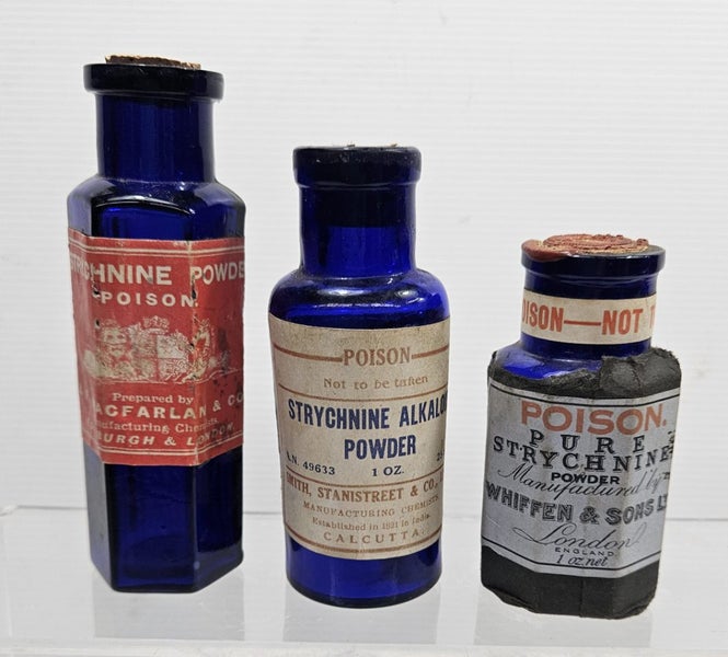 3 x Strychnine labeled blue glass bottles Carousel 1