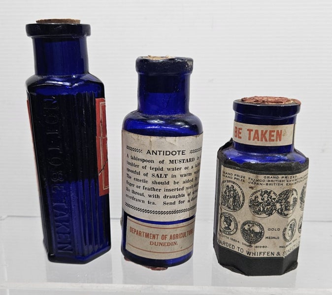 3 x Strychnine labeled blue glass bottles Carousel 2