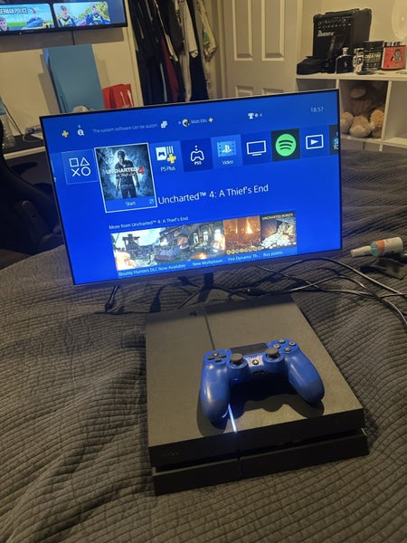 PS4 with a controller Carousel 2