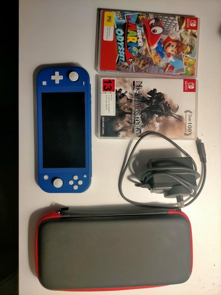 Nintendo Switch Lite Console (Blue, Barely used) + two games Carousel 1