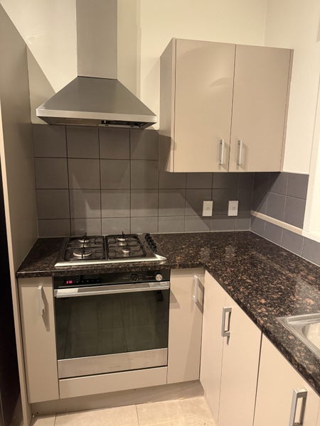 Kitchen - bench top cupboards oven sink Carousel 2