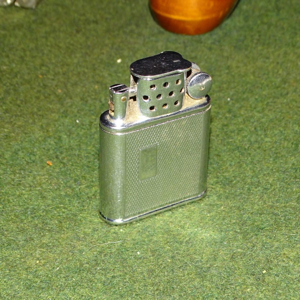 Vintage Orlik Sport Cigarette Lighter ......... Made in London Carousel 1