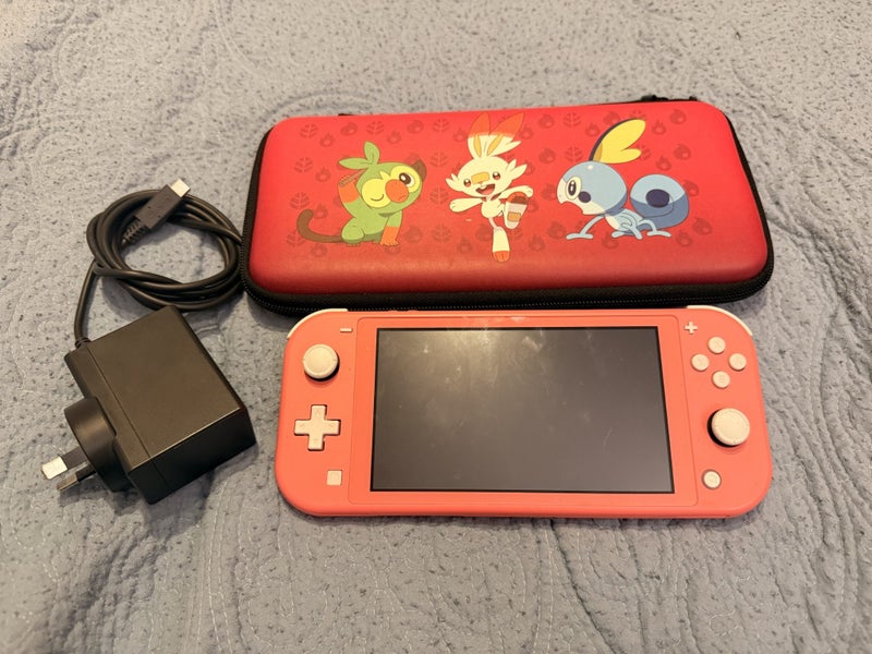 Nintendo switch lite with Pokemon case Carousel 1