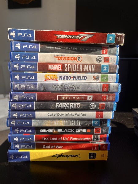 1TB PS4 Pro with one Controller and a stack of games Carousel 2