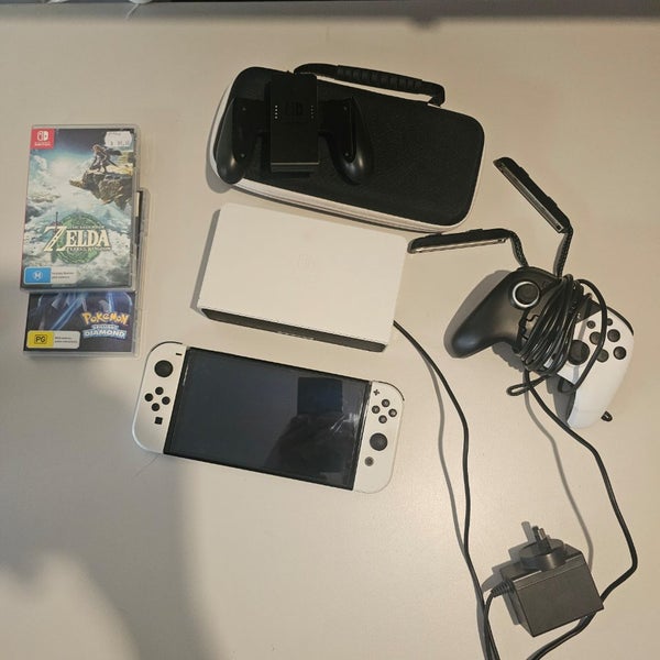 Nintendo Switch OLED + Games Carousel 1