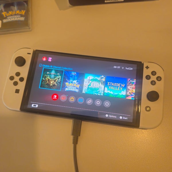 Nintendo Switch OLED + Games Carousel 3