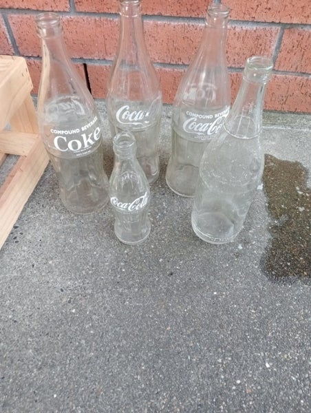 3 Large Coca-Cola and Small One and other Bottle Carousel 1