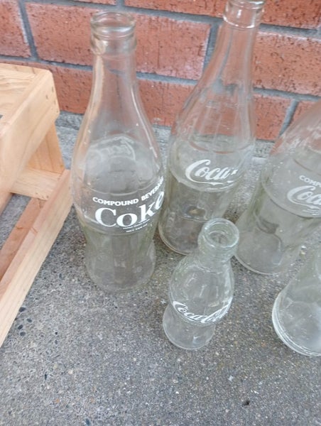 3 Large Coca-Cola and Small One and other Bottle Carousel 2