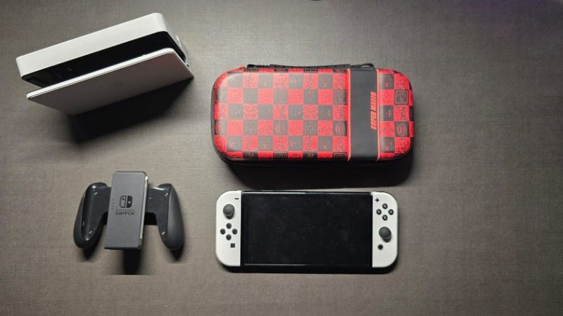Nintendo Switch OLED, boxed near new with travel case and warranty Carousel 1