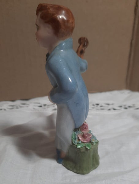 Vintage man with cello and flowers Carousel 2