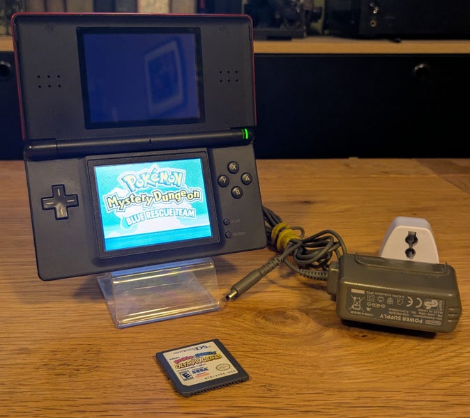 Nintendo DS Lite + Pokémon Mystery Dungeon + Mario & Sonic at the Olympic Games Carousel 1