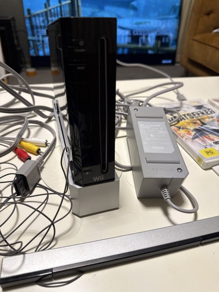 Black Wii console with two games and manual Carousel 2