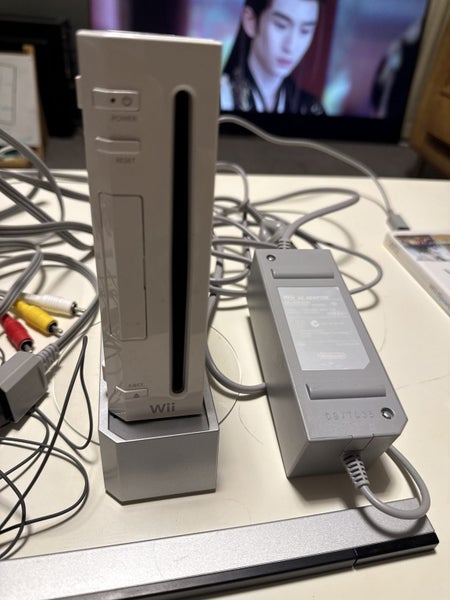 White Wii console with two games and manual Carousel 2