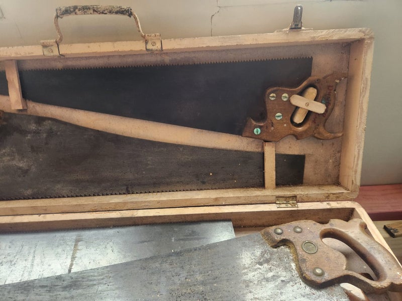 Carpenters saw box and 5 Diston handsaws. Carousel 2