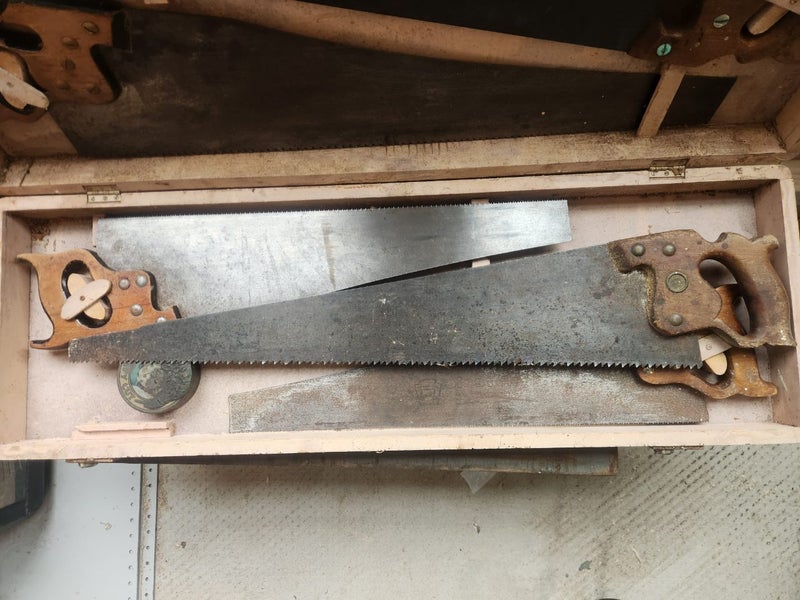 Carpenters saw box and 5 Diston handsaws. Carousel 4