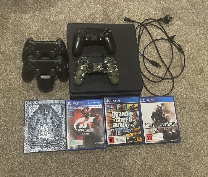 PS4 Console, 4 controllers (wireless & cable), 4 Games, controller charging dock Carousel 1