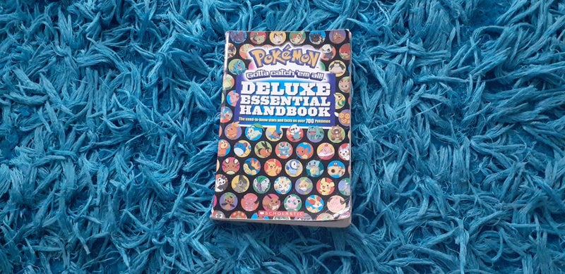 $1 RES 2015 Nintendo Pokemon Deluxe Essential Handbook Carousel 1