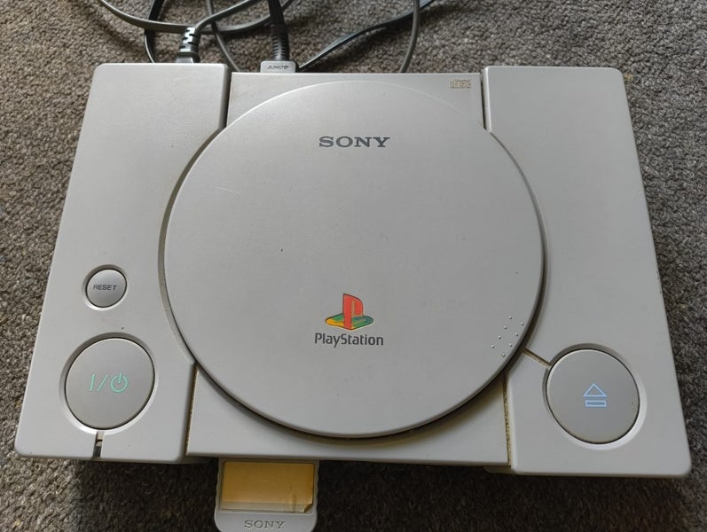 Playstation 1 console with Croc and Bugs life Carousel 2