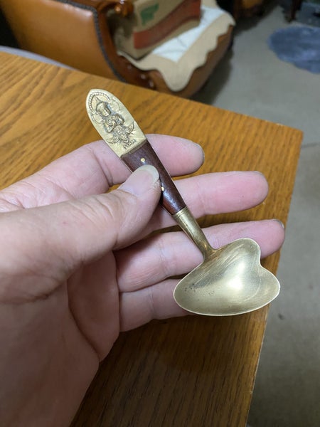 An old lovely solid brass spoon. Carousel 2
