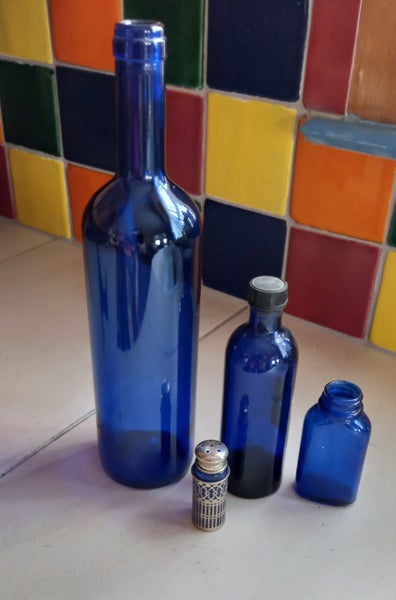 4 x Vintage Blue Glass BOttles Carousel 1
