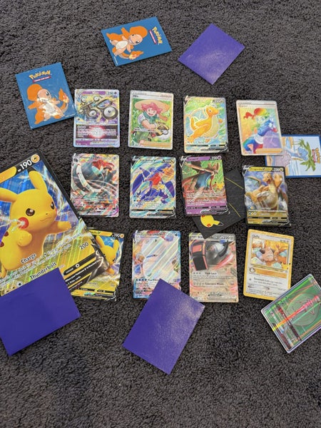 Whole book of Pokémon cards Carousel 1