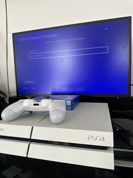 PS4, 2 games and a controller Carousel 1