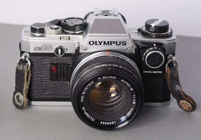 Olympus OM-10 35mm film camera with Zuiko 55mm f1.8 lens and T20 flash Carousel 2
