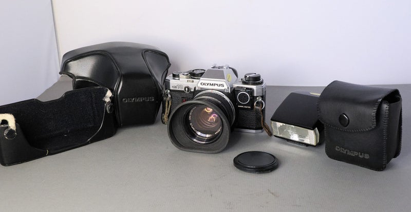 Olympus OM-10 35mm film camera with Zuiko 55mm f1.8 lens and T20 flash Carousel 1