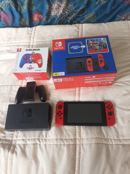 Mario Nintendo switch with dock and Mario controller Carousel 1