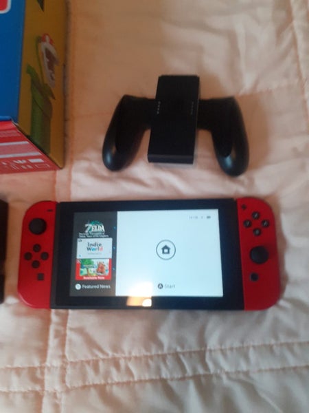 Mario Nintendo switch with dock and Mario controller Carousel 2