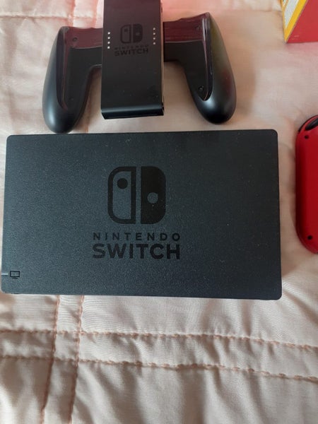 Mario Nintendo switch with dock and Mario controller Carousel 6