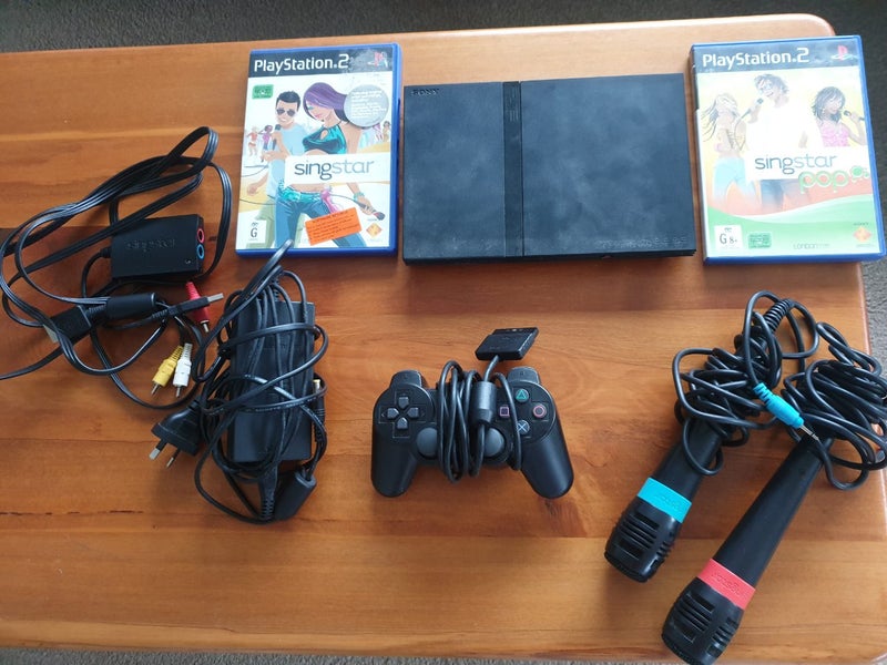 PS2 slim console with singstar game set Carousel 1