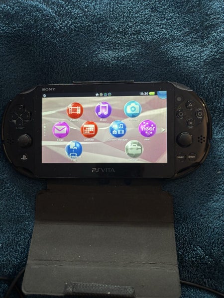 PS Vita PCH-2002 and a PSTV (VTE-1002) Carousel 4