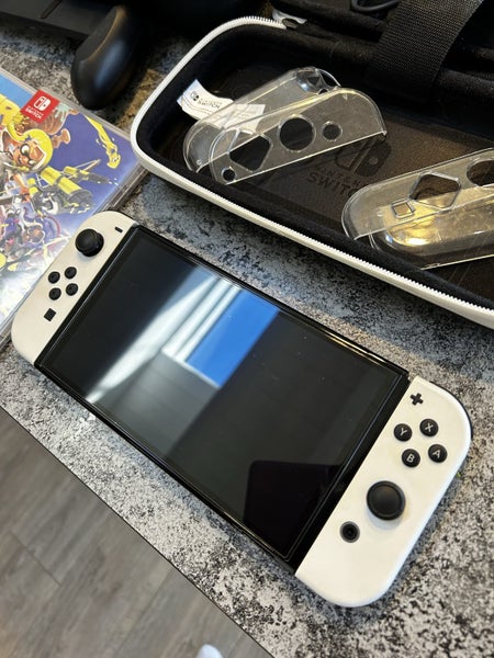 Mint condition Nintendo oled with 4x games and extras Carousel 2